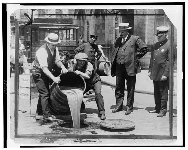 John Leach watches liquor being destroyed, 1921