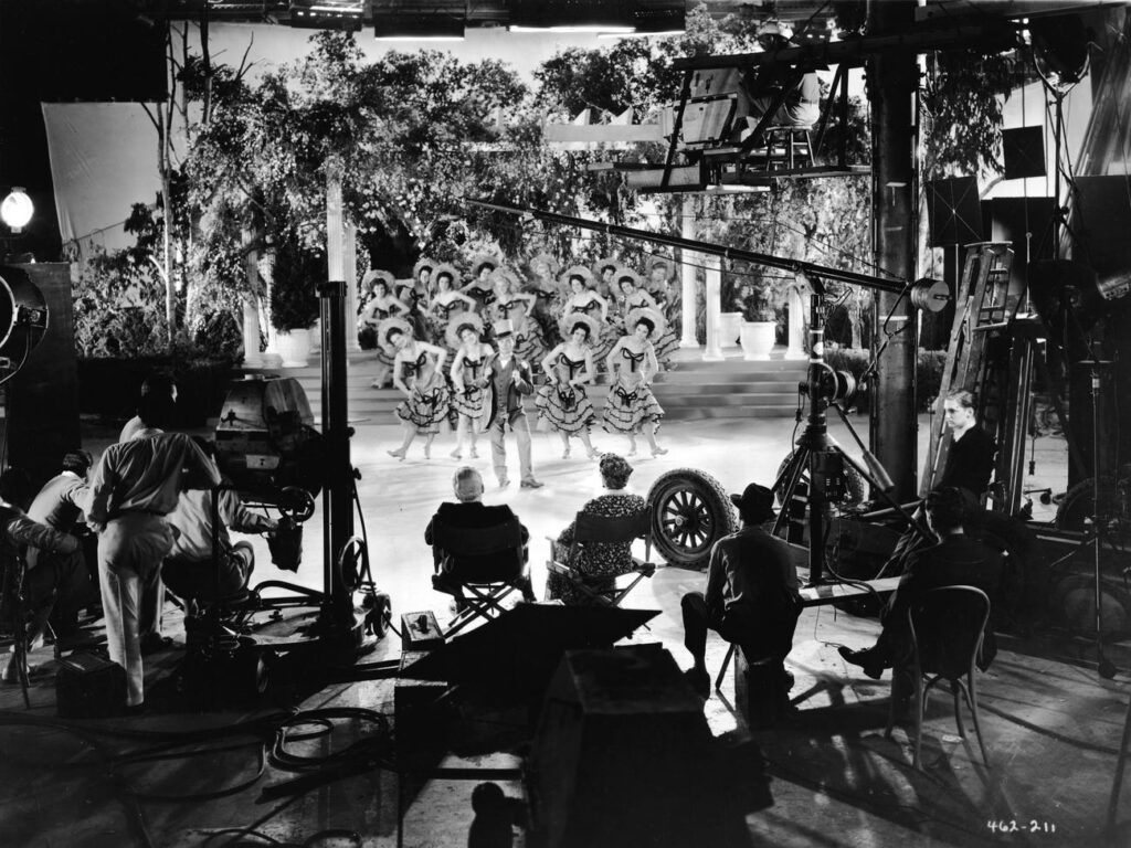 Filming of a movie in the 1920s.