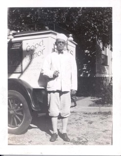 Black and white photograph of an ice cream salesman and his Good Humor truck.